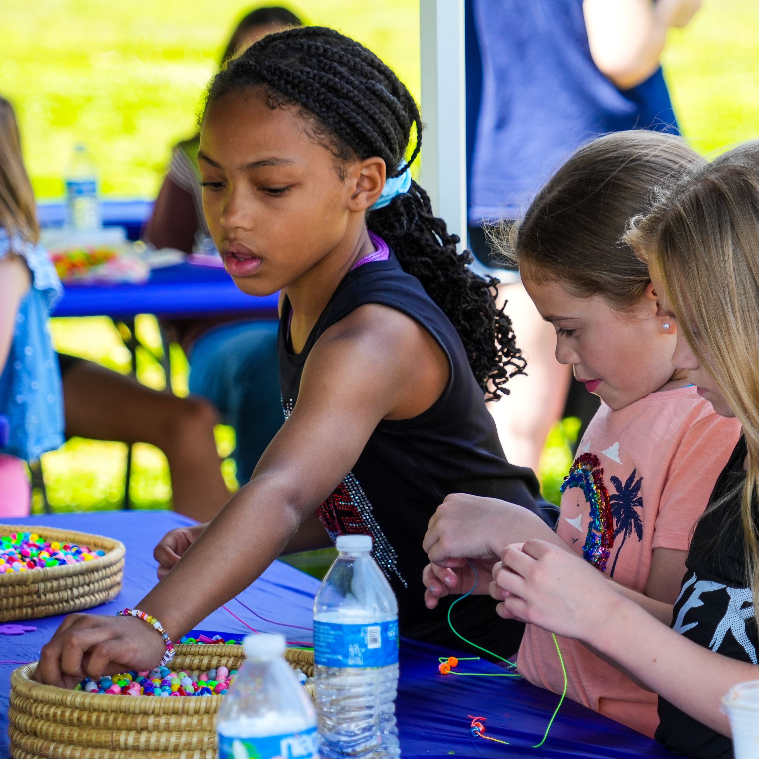 Group of kids making cards for troops